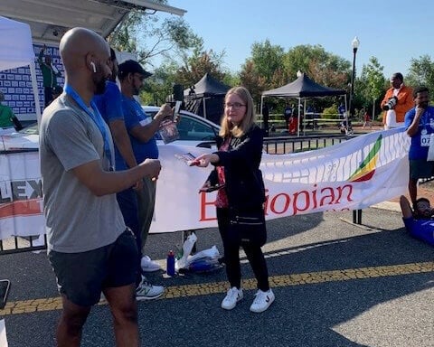 A demonstrator handing out cookies