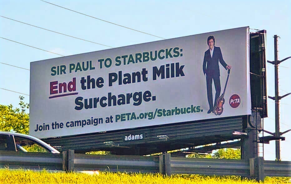 Paul McCartney calls out starbucks via billboard